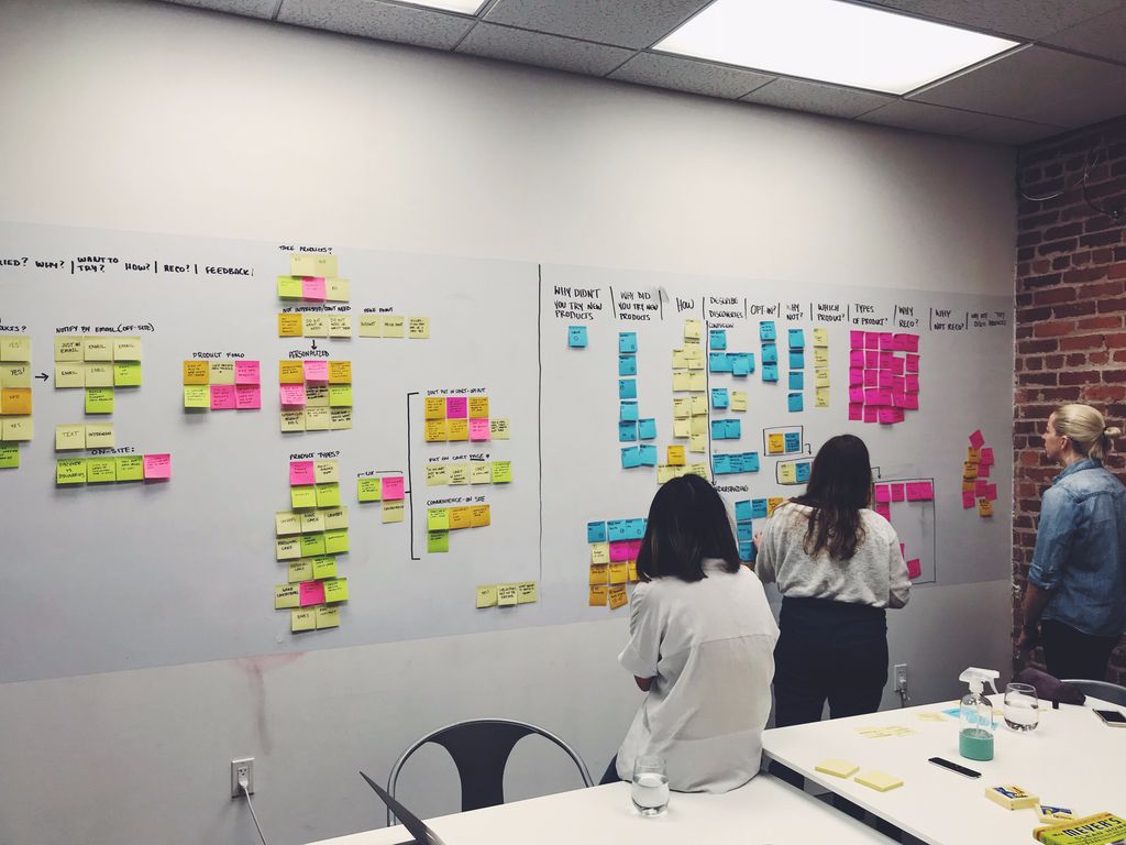 Production manager and owner reviewing financial data